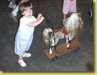 Girl with Toy Horse Walker